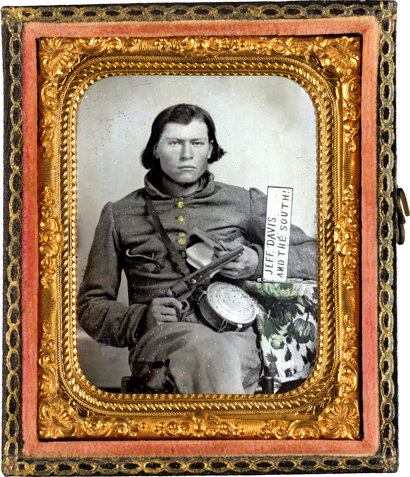 Thomas Isaiah Booker in Confederate uniform with Colt navy revolver, book, tin drum canteen, and sign reading Jeff Davis and the South!