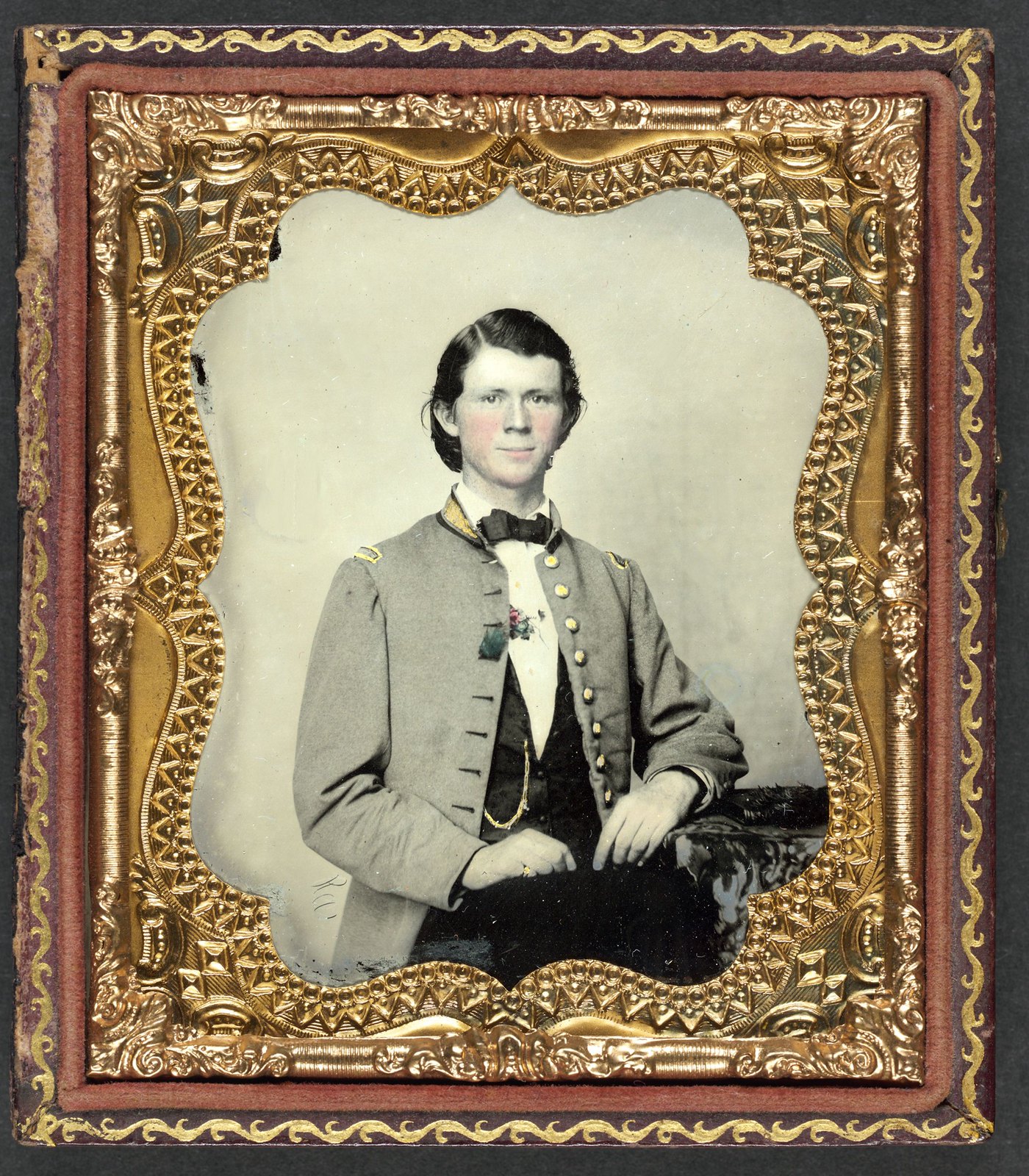 Unidentified soldier in Confederate frock coat with gold trim.
