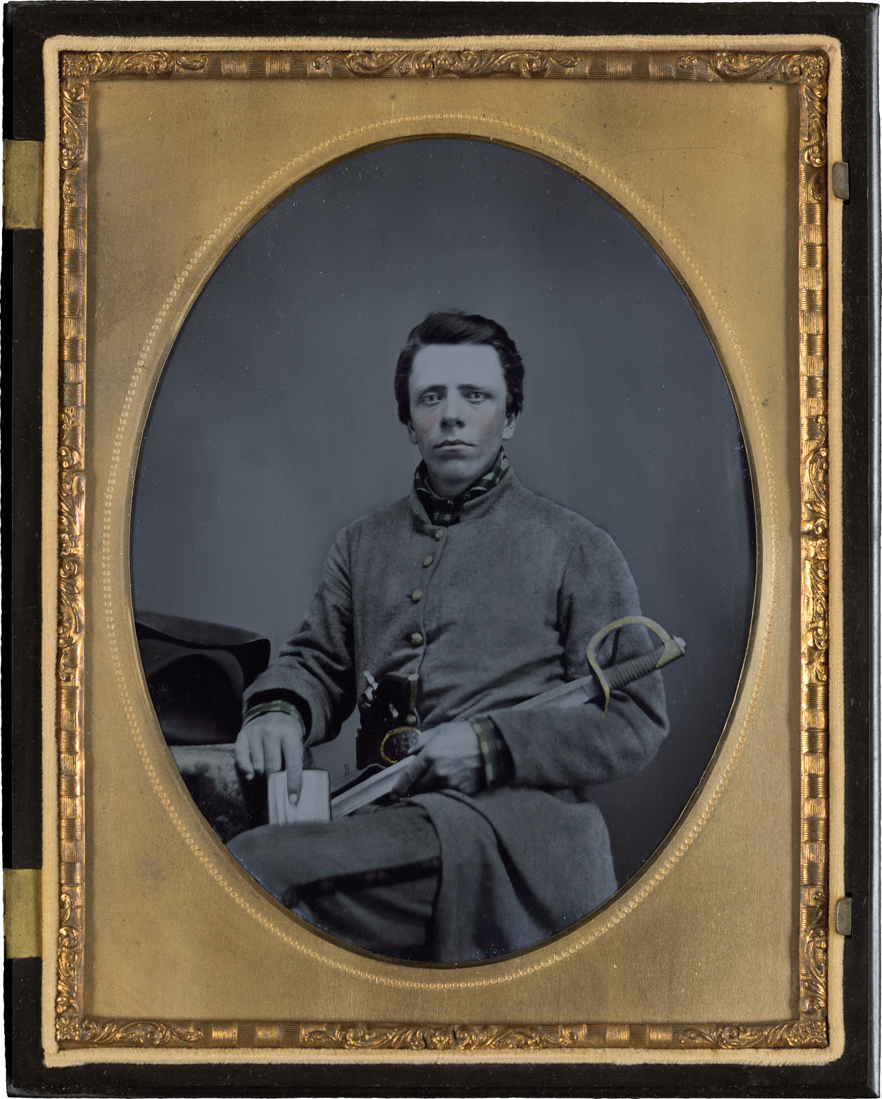 Private W.R. Clack of Co. B, 43rd Tennessee Infantry Regiment, with saber, pistol, and small book