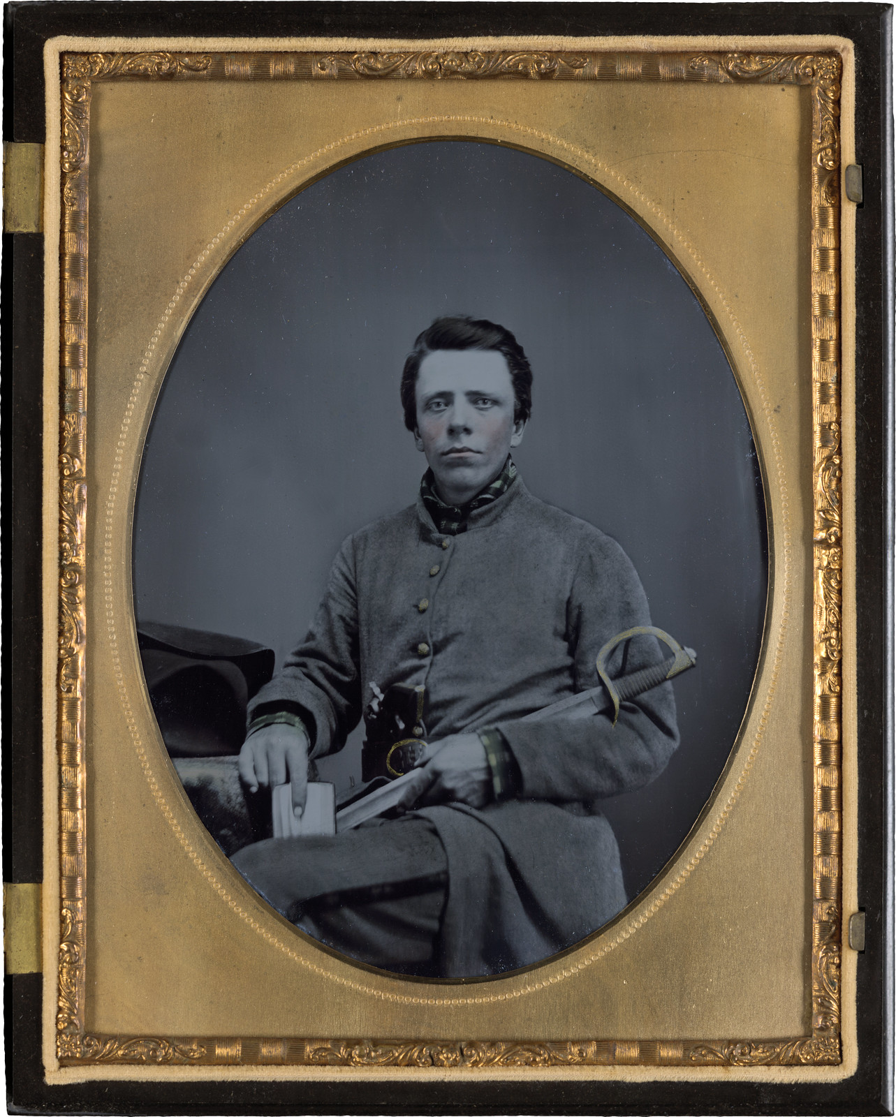 Private W.R. Clack of Co. B, 43rd Tennessee Infantry Regiment, with saber, pistol, and small book Private W.R. Clack of Co. B, 43rd Tennessee Infantry Regiment, with saber, pistol, and small book