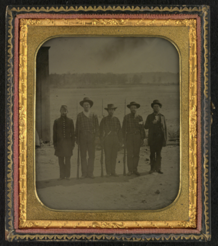 Five enlistees from Co. K, 11th Ohio Infantry Regiment, one in uniform and three in hickory shirts, at Camp Dennison, three with bayoneted rifles (before retouching)