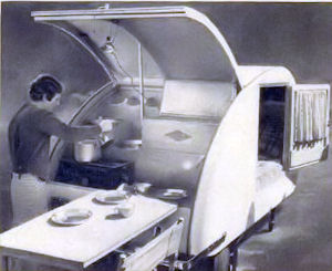 A teardrop trailer that has cooking facilities in the rear.